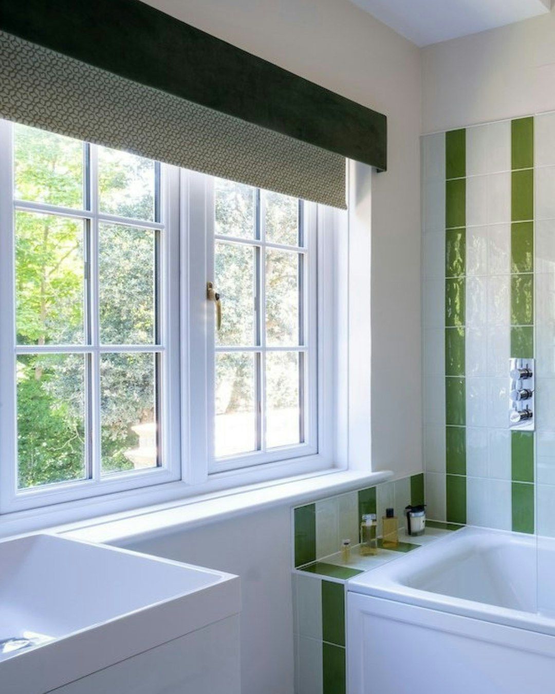 Bathroom featuring bespoke blinds on the window.